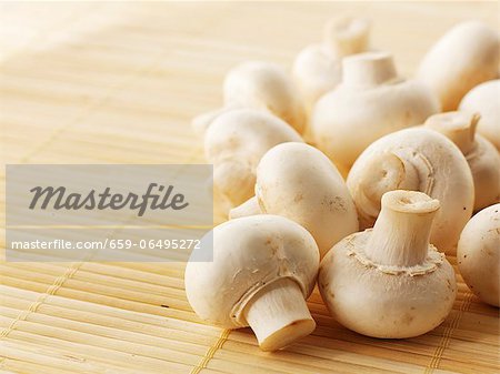 Fresh mushrooms on a bamboo mat