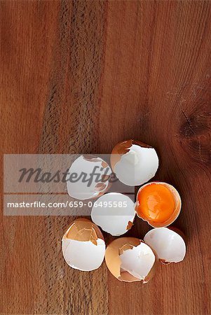 Egg shells on a wooden surface