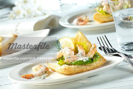 Prawns in a dill and yoghurt sauce on puff pastry with lettuce