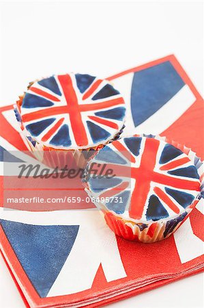 Two Union Jack cupcakes on matching paper napkins