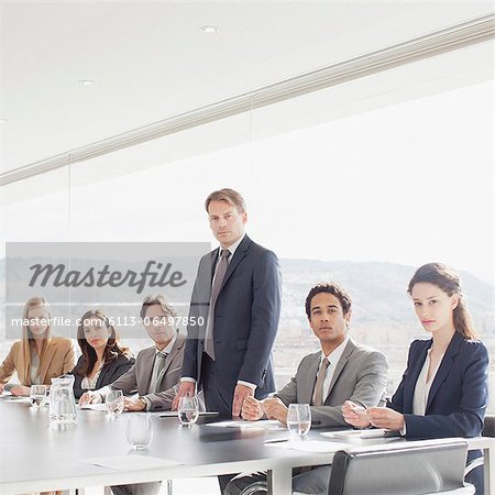 Portrait of confident business people in conference room