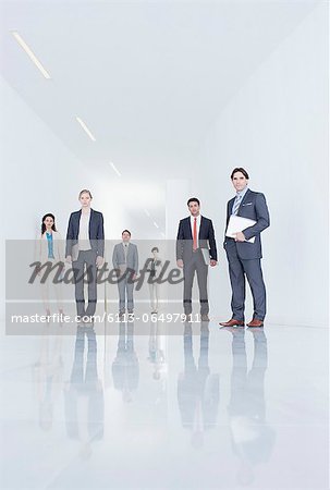 Portrait of confident business people in corridor Portrait of confident business people in corridor