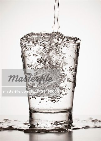 Water overflowing from glass