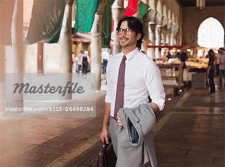 Smiling businessman at outdoor market n Venice