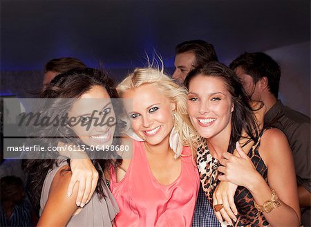 Portrait of smiling women in nightclub