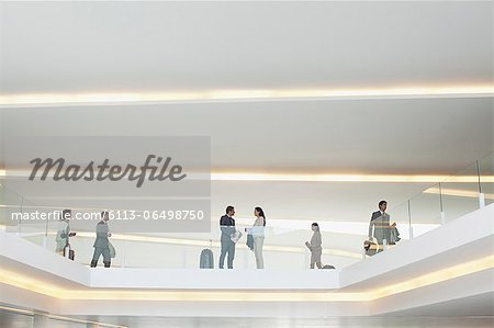 Business people on elevated walkway in airport