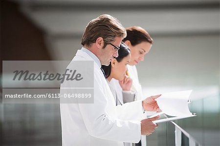Doctors reviewing medical charts