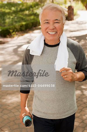 Older man smiling during workout