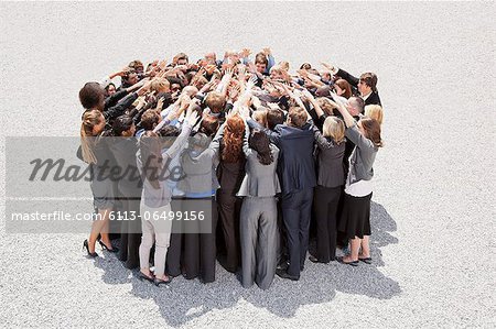Crowd of business people in huddle