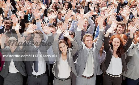 Portrait of cheering business people in crowd