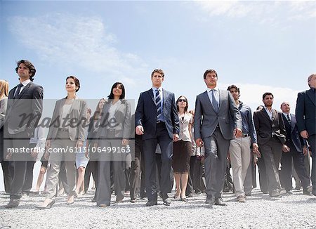 Crowd of business people walking