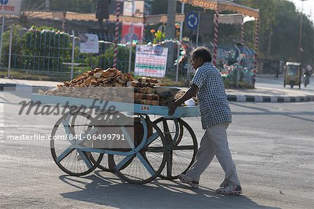 Selling varieties of bread on a push cart, Gujarat, India, Asia