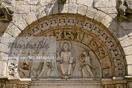 Christ in Majesty between two angels in Main porch of St. Sauveur Basilica built between the 12th and 15th centuries, Tomb of the heart of Dugesclin, Dinan, Brittany, France, Europe