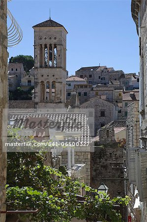 Rooftop view over the roofs to the bell tower of St. Stephens Cathedral in the medieval city of Hvar, island of Hvar, Dalmatia, Croatia, Europe