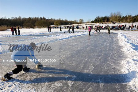 Curling on frozen Bush Loch, Gatehouse of Fleet, Dumfries and Galloway, Scotland, United Kingdom, Europe