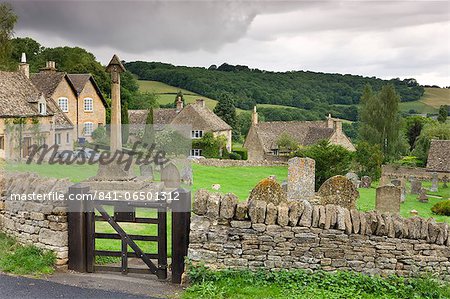 Graveyard and cottages in the pretty Cotswolds village of Snowshill, Worcestershire, England, United Kingdom, Europe