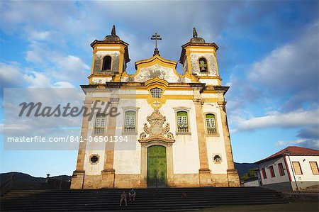 People sitting outside Sao Francisco of Assis Church in Praca Minas Gerais, Mariana, Minas Gerais, Brazil, South America