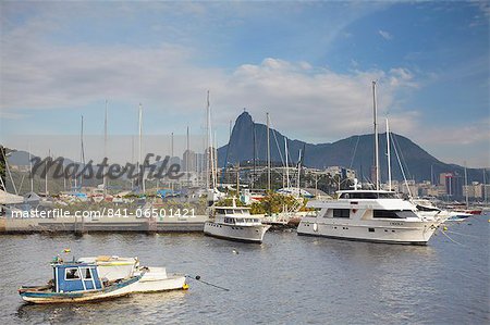 Boats in Guanabara Bay with Christ the Redeemer statue (Cristo Redentor) in the background, Urca, Rio de Janeiro, Brazil, South America