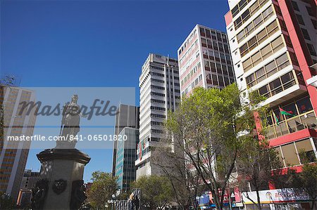 Statue and skyscrapers on Avenida 16 de Julio (El Prado), La Paz, Bolivia, South America