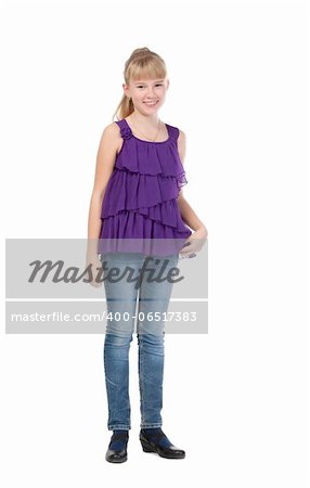 Young Girl Standing In Studio, isolated on white background