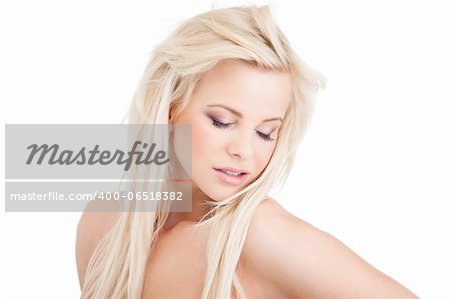 Young blond lady with a beautiful hair on white background