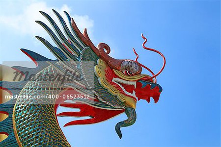 Head of Dragon on the blue sky in temple Thailand.