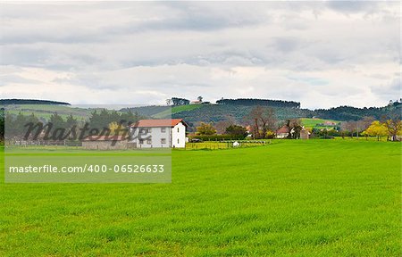 Field on the Slopes of the Pyrenees with Old Farmhouses