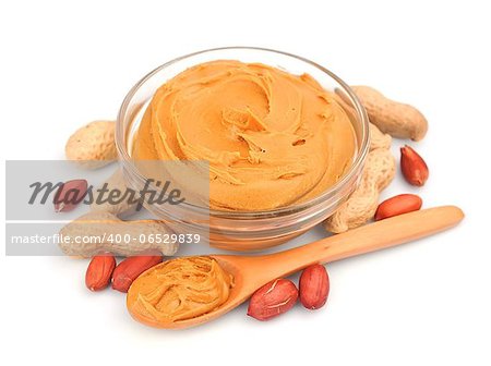 Creamy peanut butter with nuts isolated on white