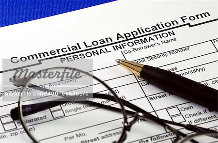 File the commercial loan application isolated on blue