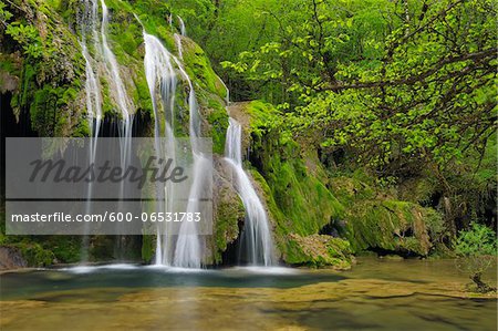 Waterfall cascading over green moss, Cascade des Tufs, Arbois, Jura, Jura Mountains, Franche-Comte, France