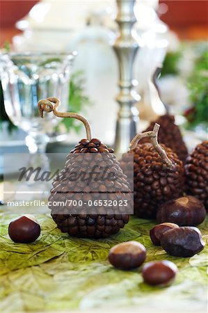 crafty pear decorations made from coffee beans with chestnuts on a tabletop