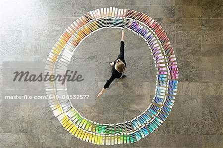 Businesswoman examining paint swatches