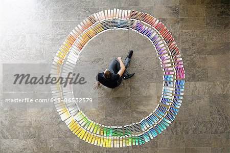 Businessman examining paint swatches Businessman examining paint swatches