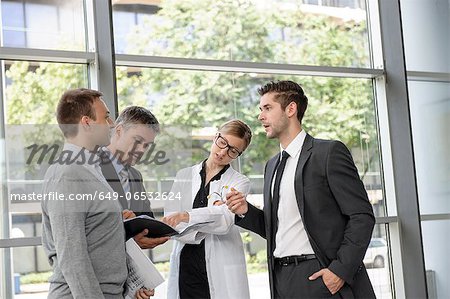 Doctor and businessmen talking
