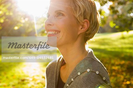 Woman smiling in park Woman smiling in park