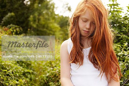 Girl walking in meadow