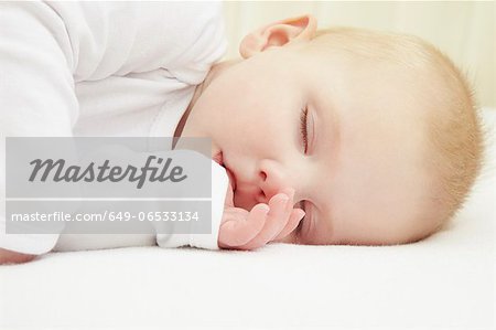 Baby girl sleeping in crib