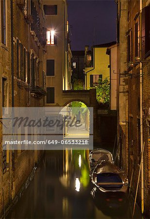 Rowboats and buildings on urban canal