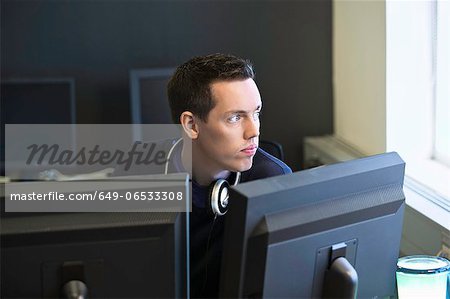 Man using computers at desk