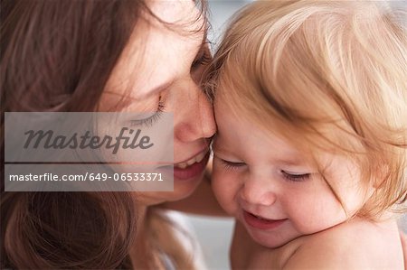 Close up of mother holding daughter