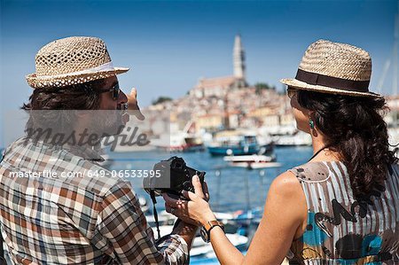 Couple looking at digital photos