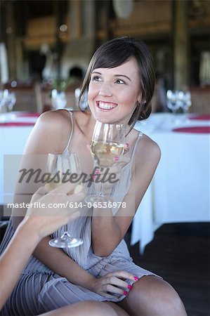 Women toasting each other with wine