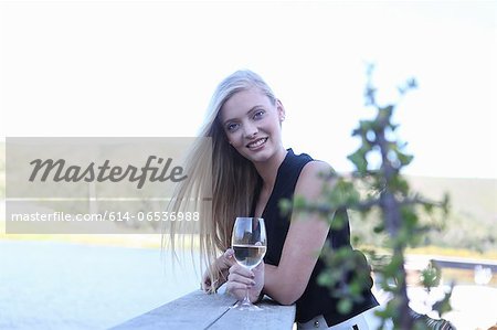 Woman drinking wine outdoors