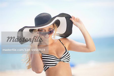 Woman wearing bikini and floppy hat