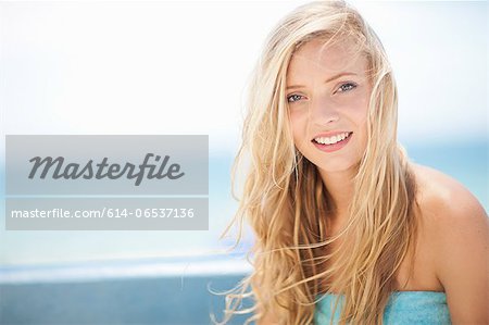 Smiling woman sitting outdoors