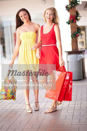 Women carrying shopping bags in mall