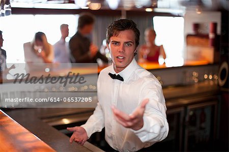 Waiter taking order at restaurant bar