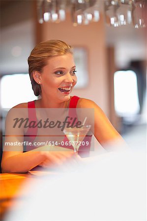 Woman having drink at bar Woman having drink at bar