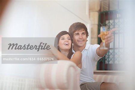 Couple relaxing on sofa together Couple relaxing on sofa together