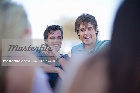 Men laughing together outdoors